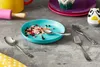 A child's cutlery set is shown on a table with some food remnants on a plate. Náhľad obrázku produktu