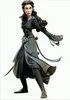 A vinyl figurine of a female elf character with dark hair and pointed ears, wearing a dark blue and gray outfit with flowing sleeves and a sword at her hip. Náhled obrázku produktu