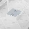 A close-up view of the underside of a white ironing board, showing a metal plate secured with two screws to a white plastic component. Produktbild-Vorschau