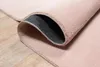 A close-up view of a pink rug, showing the underside and texture. Produktbild-Vorschau