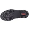 The sole of a black boot is shown against a white background. Voir les images du produit