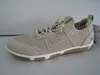 A single beige sneaker is shown from the side against a plain background. Náhled obrázku produktu