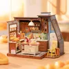 A miniature dollhouse kitchen scene with baked goods. Náhľad obrázku produktu