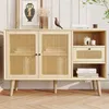 A light wood sideboard with rattan door panels and gold handles, styled in a living room setting with decorative items.