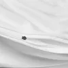 A close-up view of a white duvet cover with a zipper. Produktbild-Vorschau