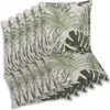A stack of chair cushions with a tropical leaf pattern. Produktbild-Vorschau
