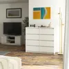 A modern living room with a dresser, TV stand, and artwork. Anteprima dell’immagine prodotto