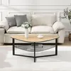 A coffee table with a kidney-shaped wooden top and a black metal frame, placed in a living room setting with a sofa and a rug. Voir les images du produit