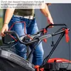 A person is holding the handle of a lawnmower. Produktbild-Vorschau