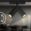 A close-up shot of a black track light with two adjustable spot heads, showcasing its design and functionality. Anteprima dell’immagine prodotto
