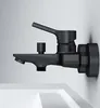 A black faucet mounted on a white wall above a white sink. Produktbild-Vorschau