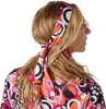 A woman wearing a colorful hippie-style dress and headband, shown from the back and side. Produktbild-Vorschau