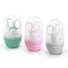 Three baby nail care sets in different colors (green, pink, and gray), each in a clear plastic case with a colored base. Produktbild-Vorschau