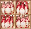 A set of 12 Christmas gnome ornaments arranged in a wooden box. Náhled obrázku produktu