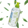 A bottle of Bioglide natural lubricant surrounded by green leaves on a white background. Náhľad obrázku produktu