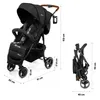 A black baby stroller with dimensions indicated by text and lines. Produktbild-Vorschau