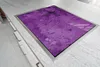 A close-up, angled view of a purple glass cutting board set into a granite countertop. Náhled obrázku produktu