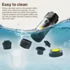 A portable coffee maker and its disassembled parts are shown submerged in water, illustrating its easy-to-clean feature. Náhľad obrázku produktu