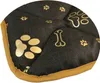 A close-up view of a dark-colored dog mat with gold paw print and bone patterns. Náhled obrázku produktu