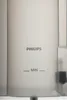 A close-up of a translucent gray water tank with markings and a Philips logo. Produktbild-Vorschau