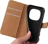 A hand holding a black phone case, with the inside of a brown wallet-style phone case visible. Produktbild-Vorschau