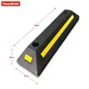 A black parking curb with yellow reflective strips and measurement indicators. Náhled obrázku produktu