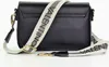 A black Valentino Bags bodybag with a branded strap is shown against a white background. Produktbild-Vorschau