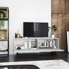 A modern TV stand with a television and decorative items. Produktbild-Vorschau