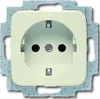 A close-up, front-facing view of a cream-colored electrical outlet with a gray metal mounting frame. Anteprima dell’immagine prodotto