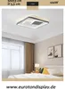 A modern bedroom with a ceiling light fixture above a bed. Produktbild-Vorschau