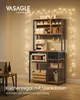 A kitchen shelf unit is displayed with various kitchen appliances and items, decorated with string lights. Produktbild-Vorschau