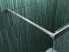 A close-up view of a shower enclosure corner with a metal support bar and tiled wall. Produktbild-Vorschau