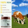 A jar of whipped tallow cream is shown next to a herd of cows grazing in a field under a blue sky with clouds. Produktbild-Vorschau