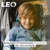 A young boy wearing headphones sits in a car seat, smiling. The image includes marketing icons and text. Náhľad obrázku produktu