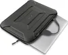 A black laptop bag with a textured, geometric design is shown with a silver laptop partially inserted. A handle is attached to the bag. Náhled obrázku produktu