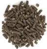 A pile of small, dark brown pellets on a white background. Podgląd zdjęcia produktu