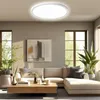 A modern living room with a sectional sofa, coffee table, and large windows. Anteprima dell’immagine prodotto