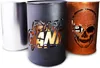 Three metal barrels with cut-out designs, one silver, one black with a logo, and one copper with a skull. Produktbild-Vorschau