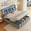 A bed with storage and LED lighting in a bedroom setting. Produktbild-Vorschau