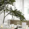 A table setting with a Christmas tree branch and decorative lights. Produktbild-Vorschau