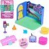 A collection of toys, including a playset with a road and door, a toy car, a traffic light, and other accessories, arranged on a white background. Produktbild-Vorschau