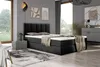 A modern bedroom with a black boxspring bed, nightstand, rug, and artwork. Produktbild-Vorschau