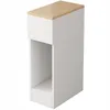 A narrow white nightstand with a wood-tone top and an open shelf. Produktbild-Vorschau