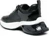 A rear view of a black and white sneaker. Náhled obrázku produktu
