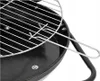 A close-up view of a black charcoal grill with a silver grate. Produktbild-Vorschau