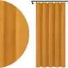 A close-up and full view of a yellow velvet curtain hanging from a curtain rod. Náhled obrázku produktu