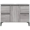 A front view of a gray wood-grain bathroom vanity cabinet with black legs. Náhled obrázku produktu