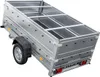 A silver trailer with black accents, shown from a diagonal rear-three-quarter view against a white background. Produktbild-Vorschau