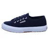 A side view of a navy blue Superga sneaker with a white sole. Produktbild-Vorschau