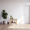 A wooden bench with shoes and plants in a room with a white wall and a white door. Voir les images du produit